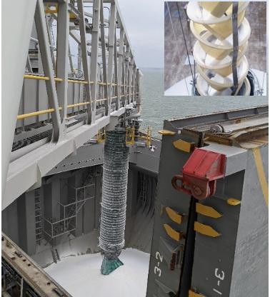 Replacement shiploader loading alumina into a vessel in Gladstone using a Cleveland™ Cascade Chute with inset showing the internal cone arrangement for dust suppression.